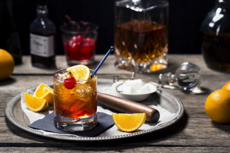 Serving Old Fashioned Cocktail